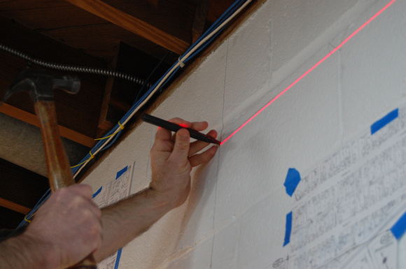 Marking the wall for shelf bracket standard attachment